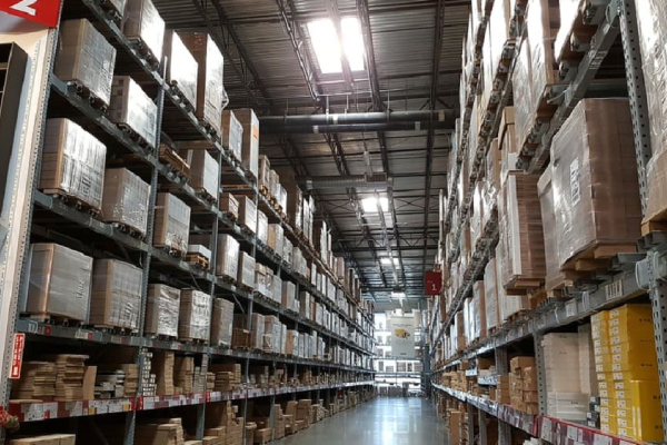 Image of Huge Distribution Warehouse With High Shelves and Loaders.